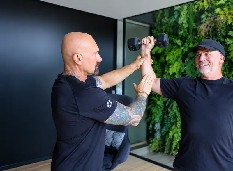 Grant supporting a client during personal training